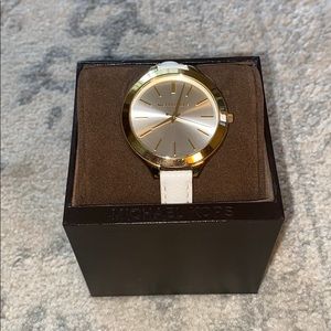 White leather band, pearl analog dial/gold accents